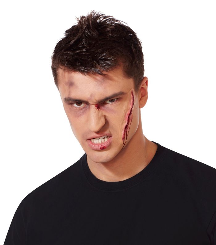 Spirit Halloween product photograph showing a long simulated gash applied to a model’s cheek.