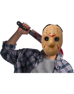 a man in a hockey mask with a big machete at night. black and