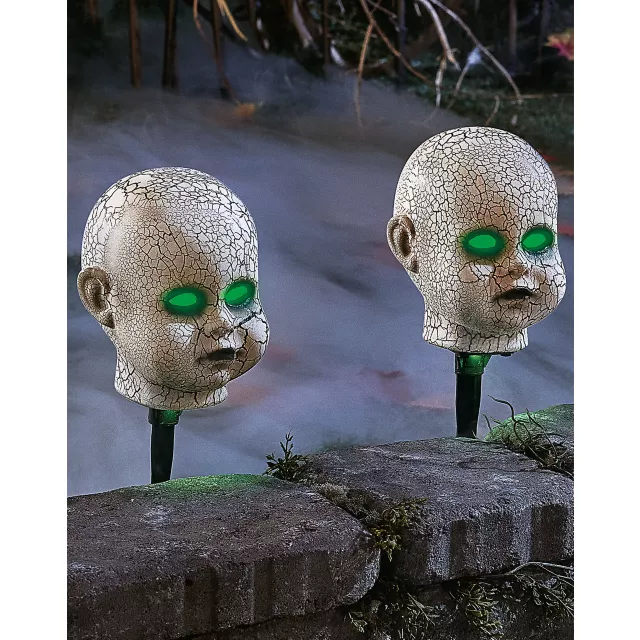 Light-Up LED Cracked Doll Pathway Markers at Spirit Halloween
