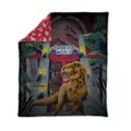 Jurassic World Reversible Fleece Blanket at Spirit Halloween