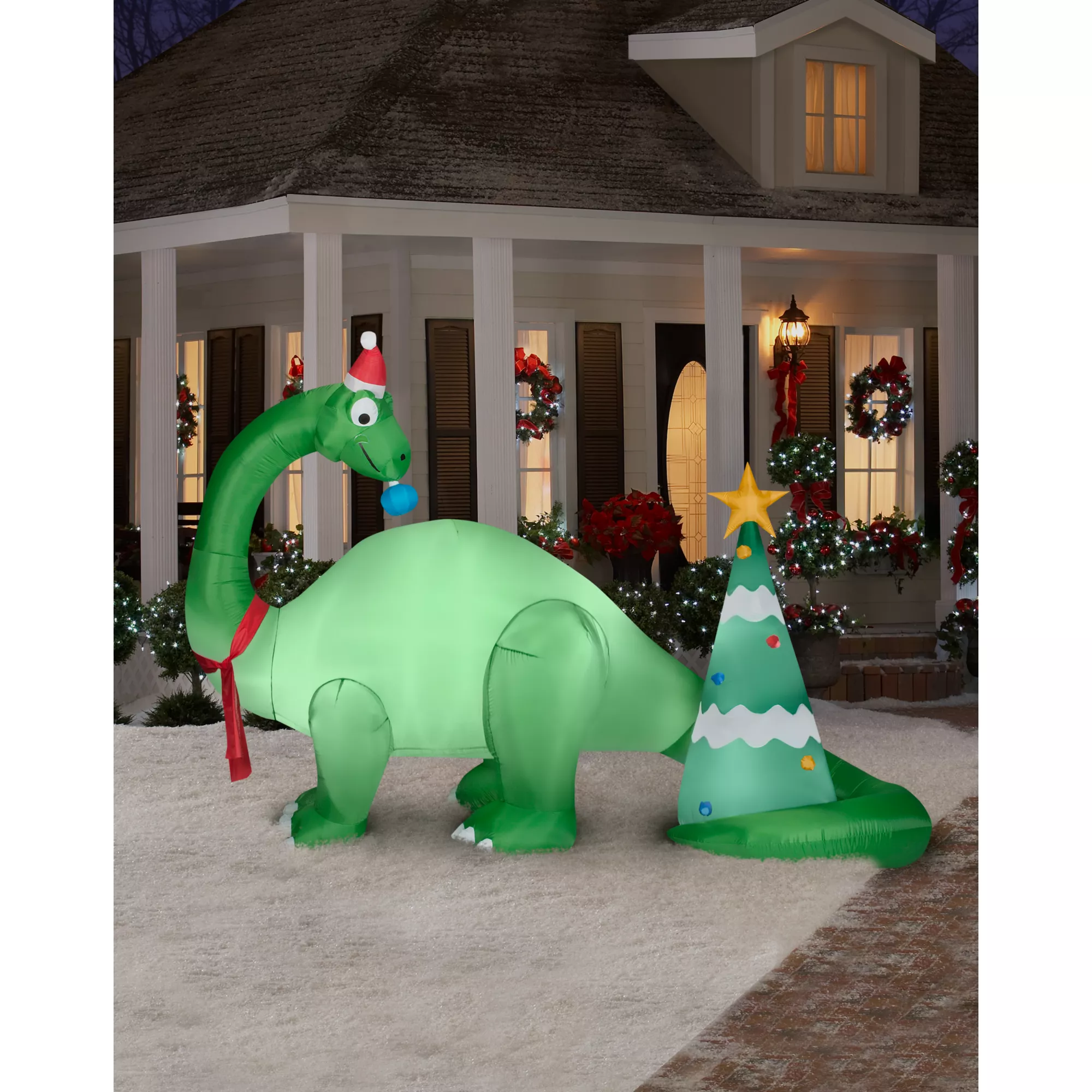 Giant Brontosaurus and Christmas Tree Inflatable at Spirit Halloween