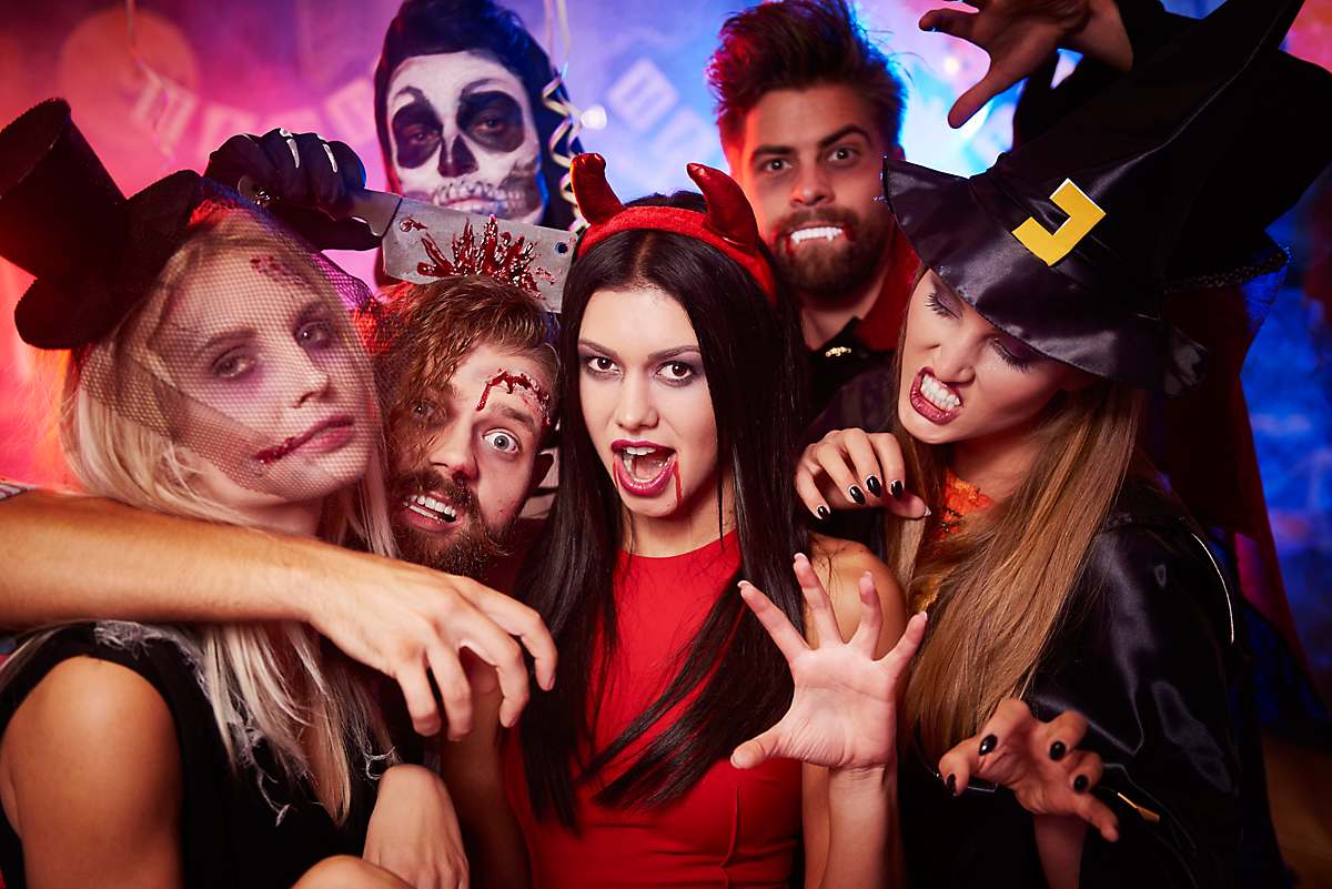 A group of costumed friends gets into the Halloween festivities