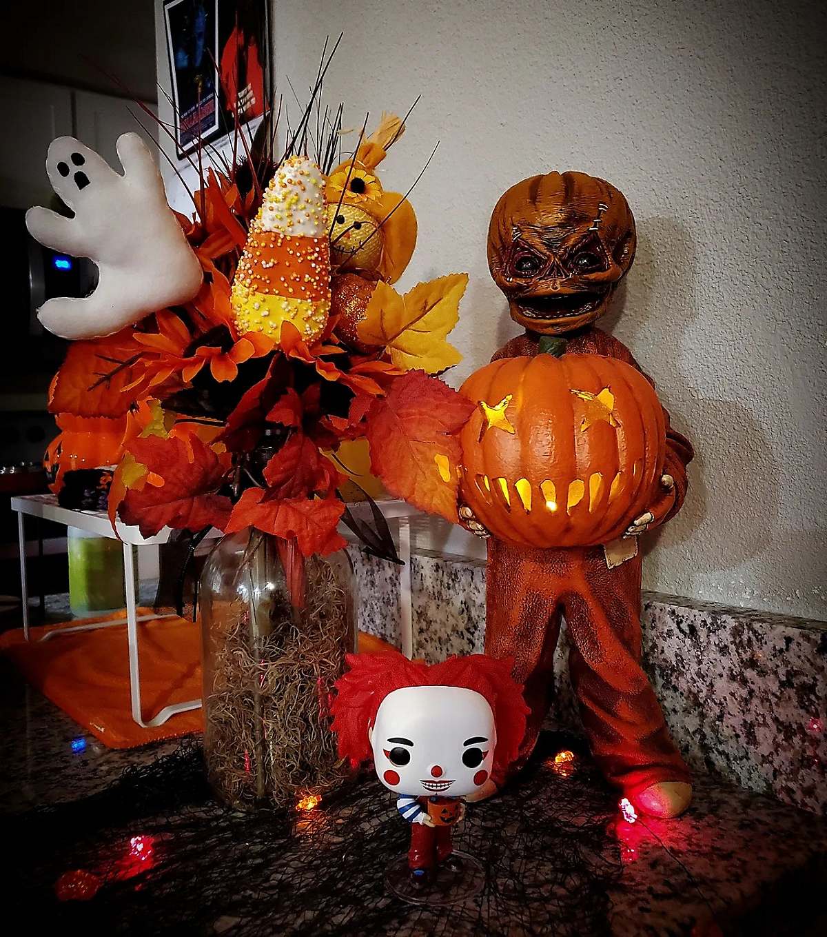 Chuckles the Clown figure and light-up pumpkin and Halloween and fall bouquet