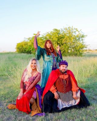 Three people dressed as the Sanderson Sisters from Hocus Pocus